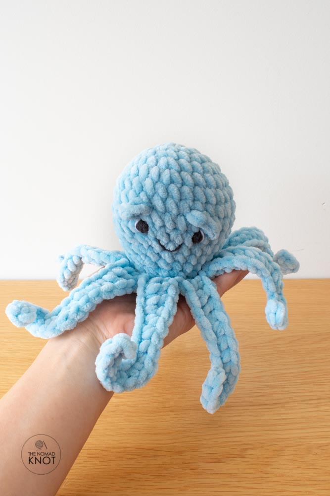 easy no-sew crochet octopus held by one hand