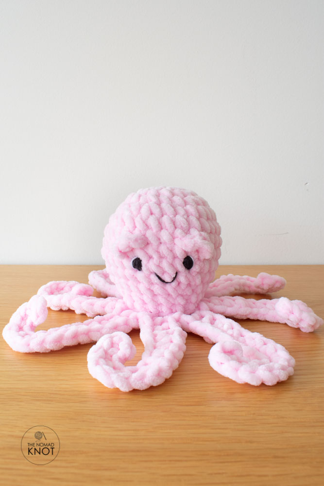easy no-sew crochet pink octopus on top of a shelf