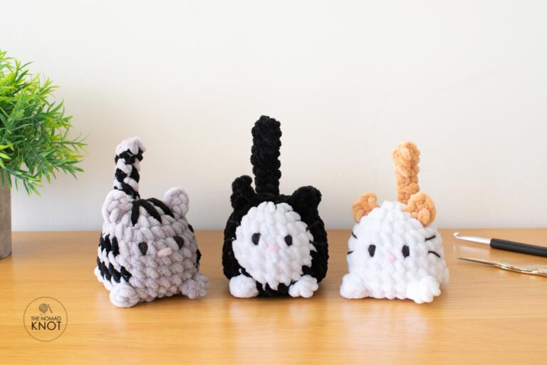 three chubby crochet plush cats called little chonkers on top of a table. Free amigurumi cat pattern